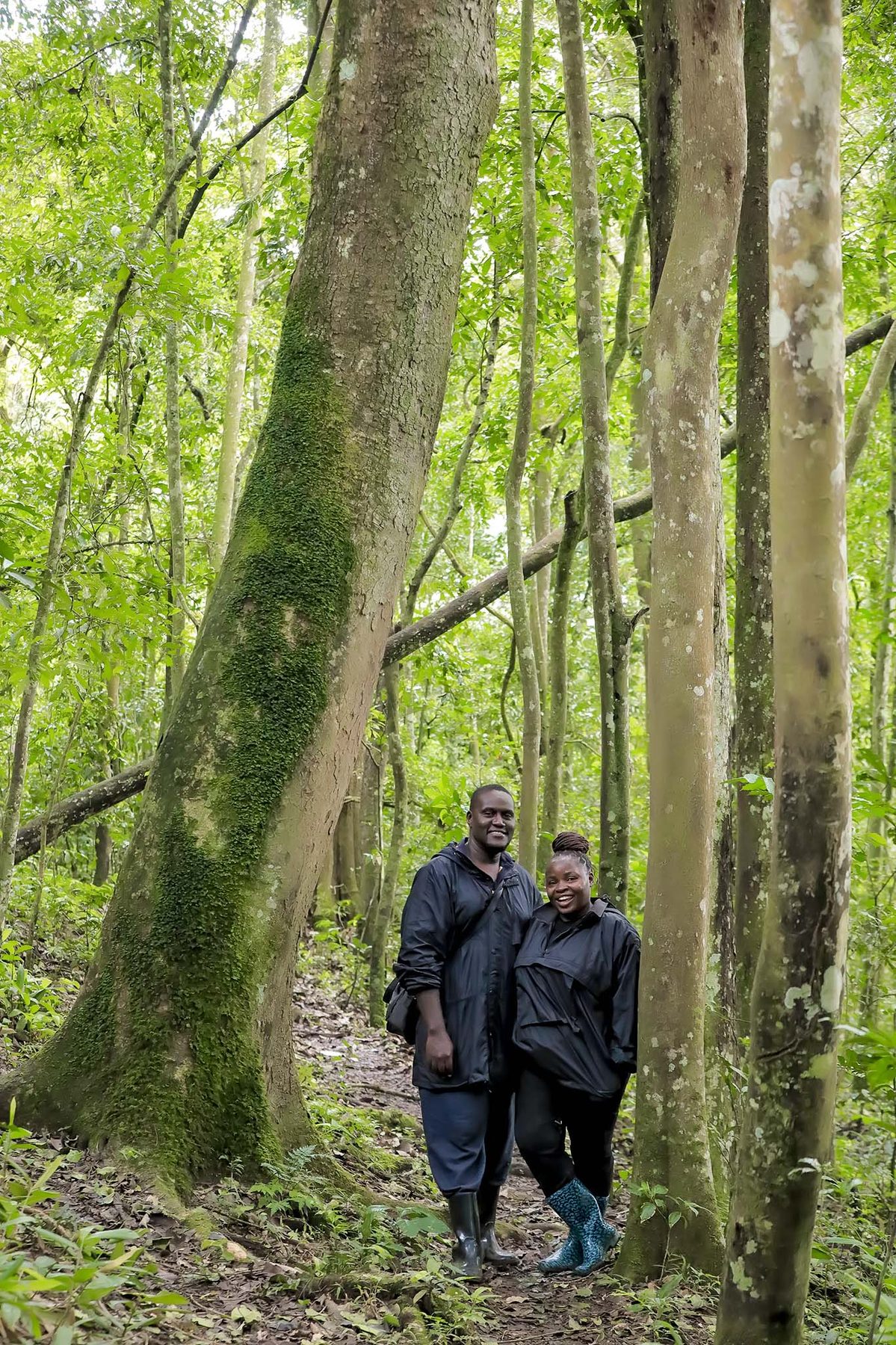 Young conservation champion standing in a forest setting